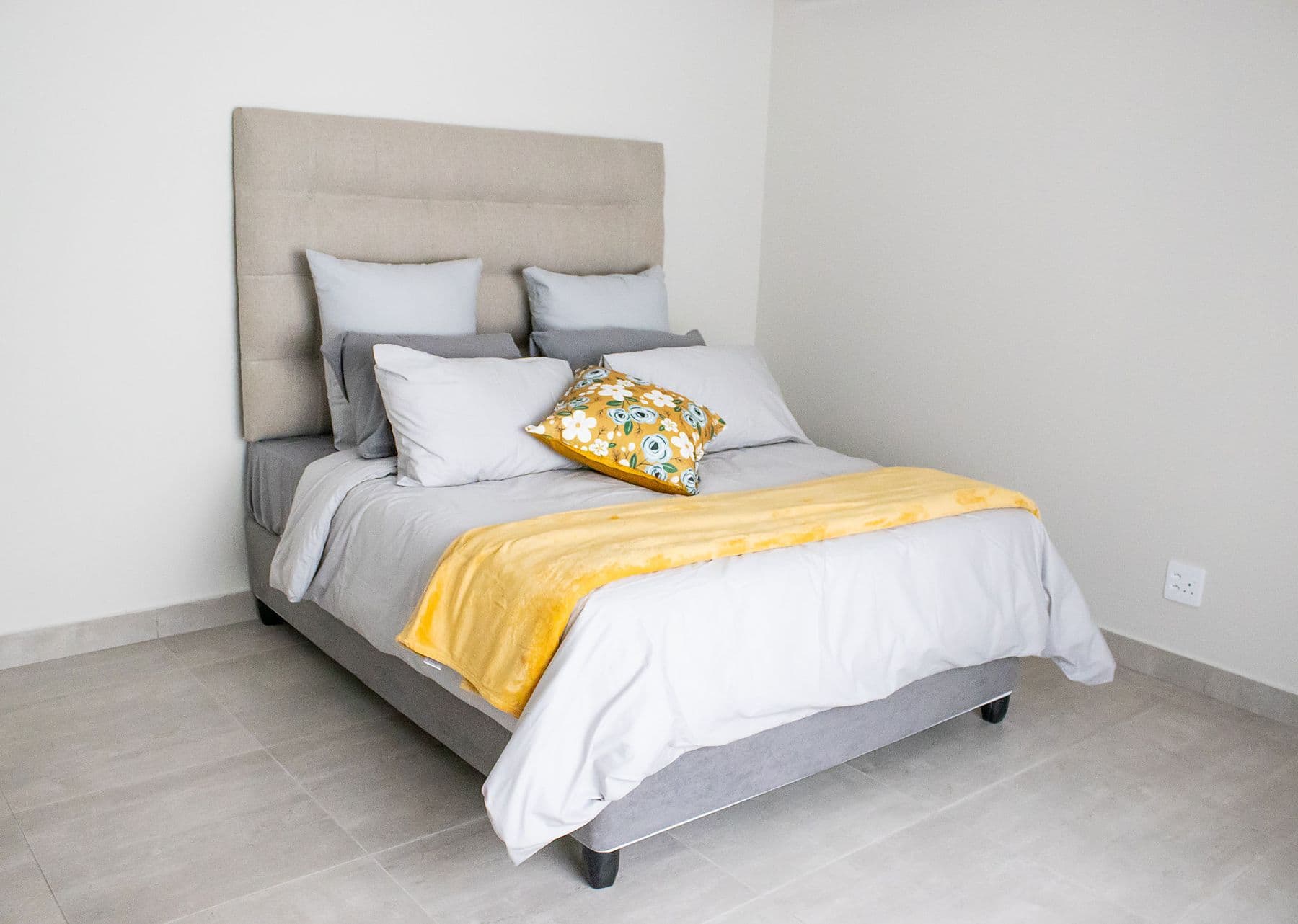 Family unit: bedroom with yellow throw