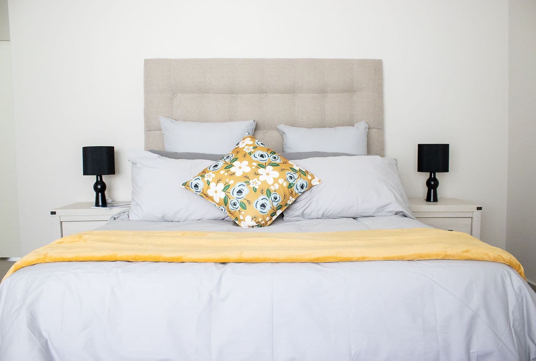 Bedroom with yellow throw