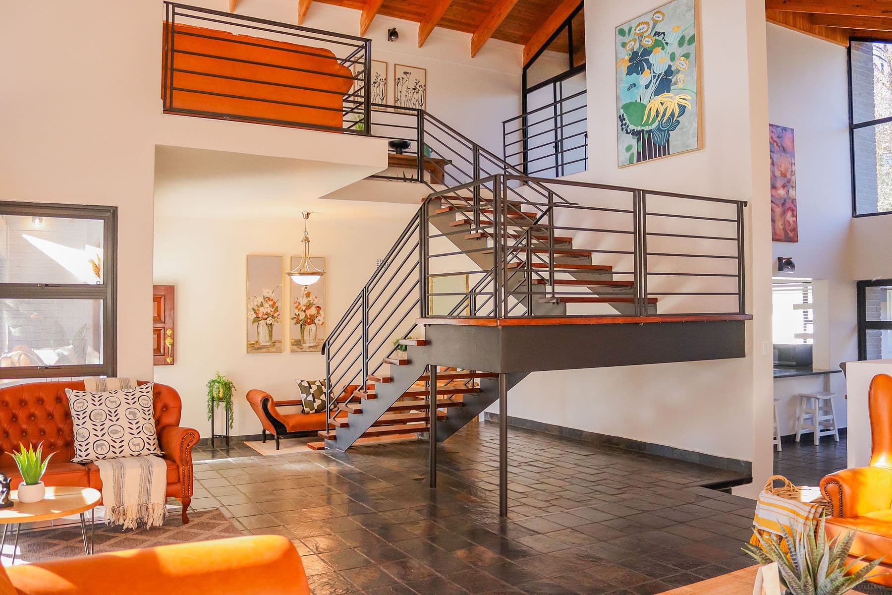 Lounge and staircase under timber ceiling