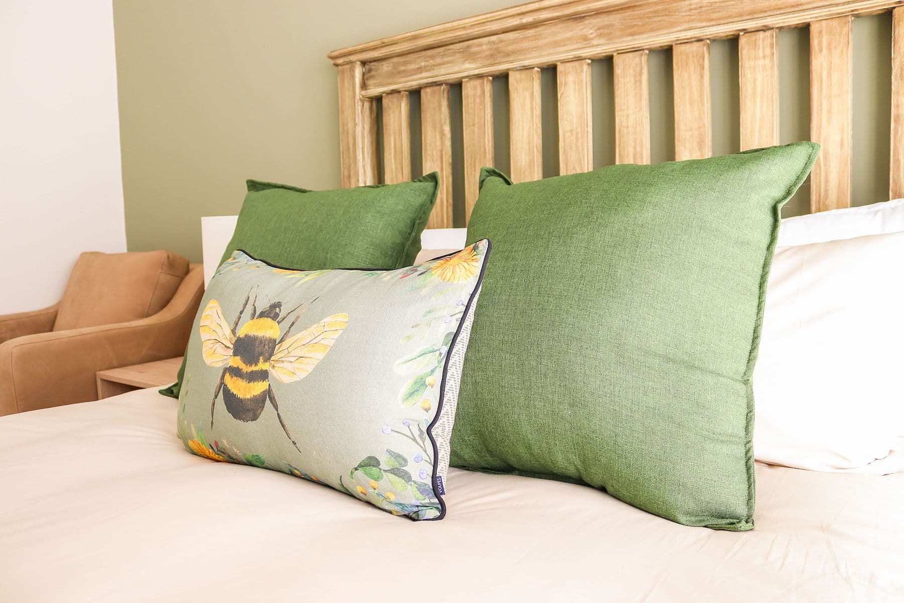 Sage Room: bed detail with bee cushion