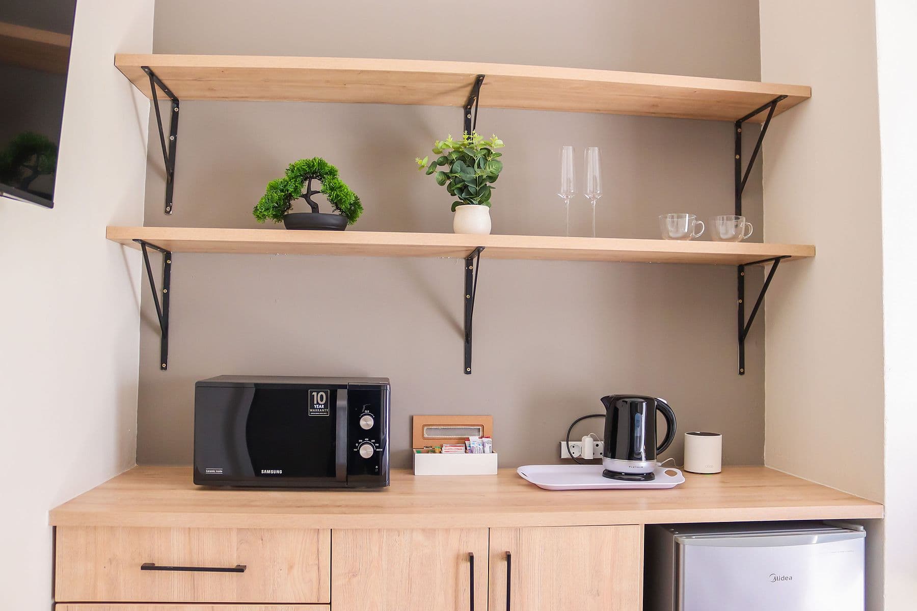 Charcoal Room: kitchenette shelves with microwave and kettle
