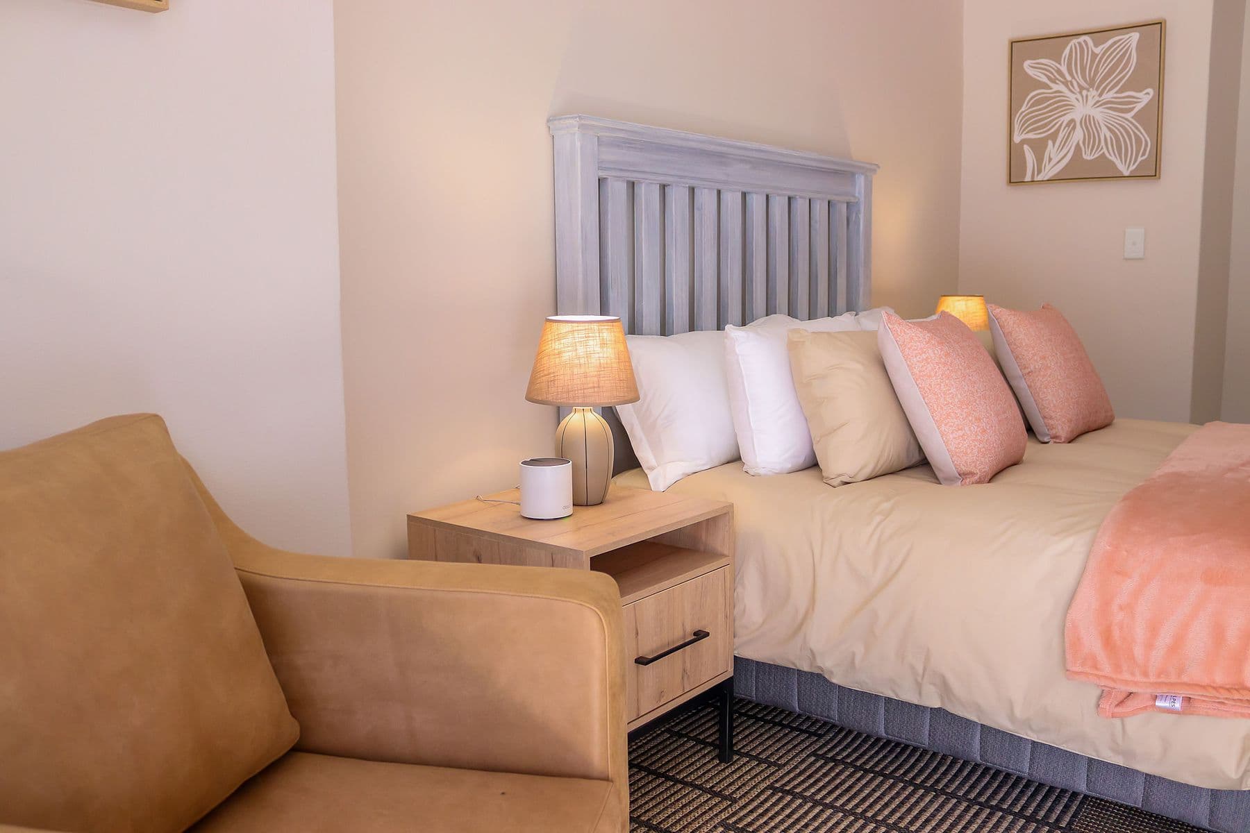 Blush Room: bed with blush throw and armchair