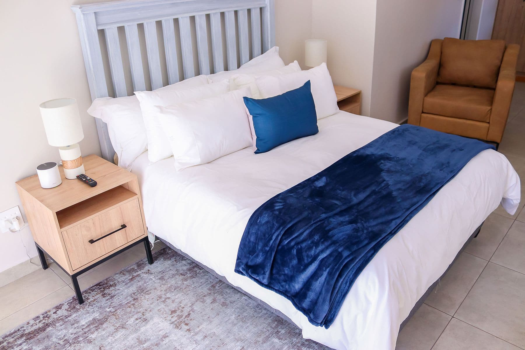 Navy Room: bed and armchair