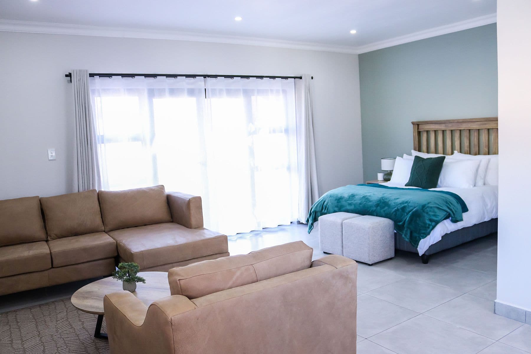 Teal Suite: sitting area opening onto the bedroom